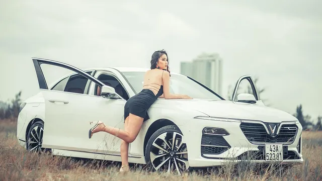 Woman enters a car